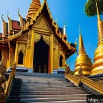Home 20 태국 사원의 종류 - A majestic royal Thai temple at sunrise, featuring intricate golden spires and vibrant, richly decor...